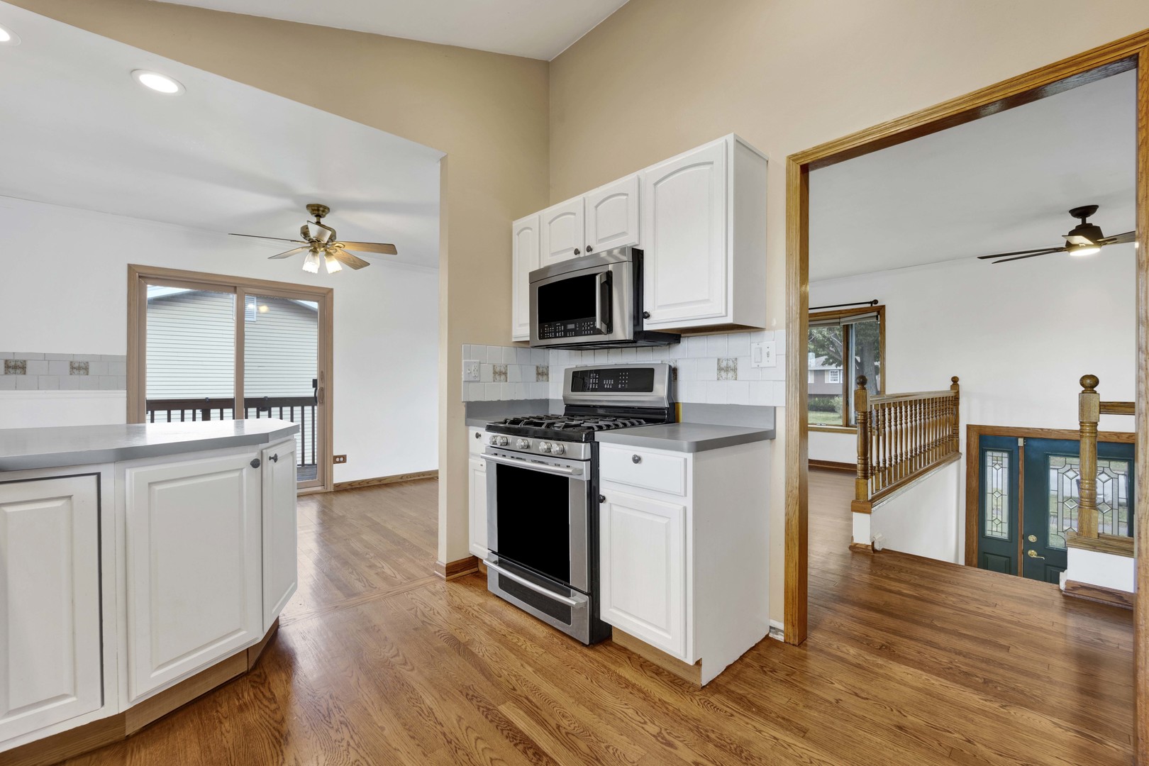2S224 Valley Road Lombard, IL 60148 - Photo 4 of 37 a kitchen with stainless steel appliances a stove microwave and a refrigerator