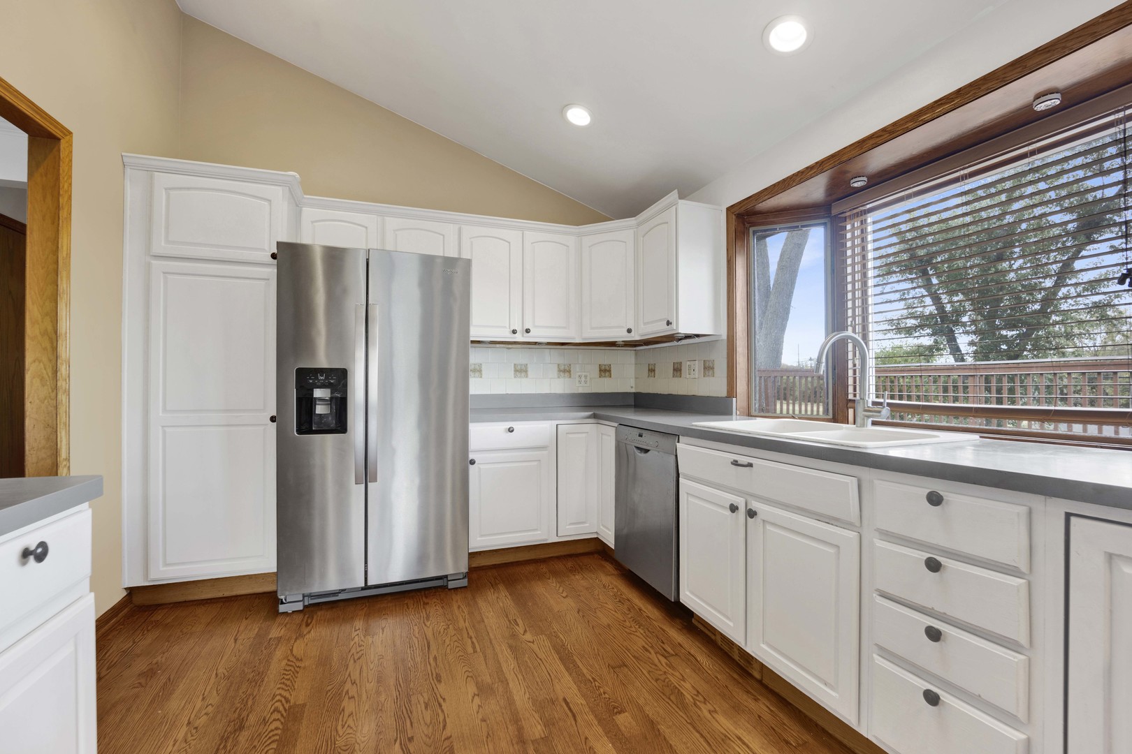 2S224 Valley Road Lombard, IL 60148 - Photo 6 of 37 a kitchen with stainless steel appliances a refrigerator and a sink
