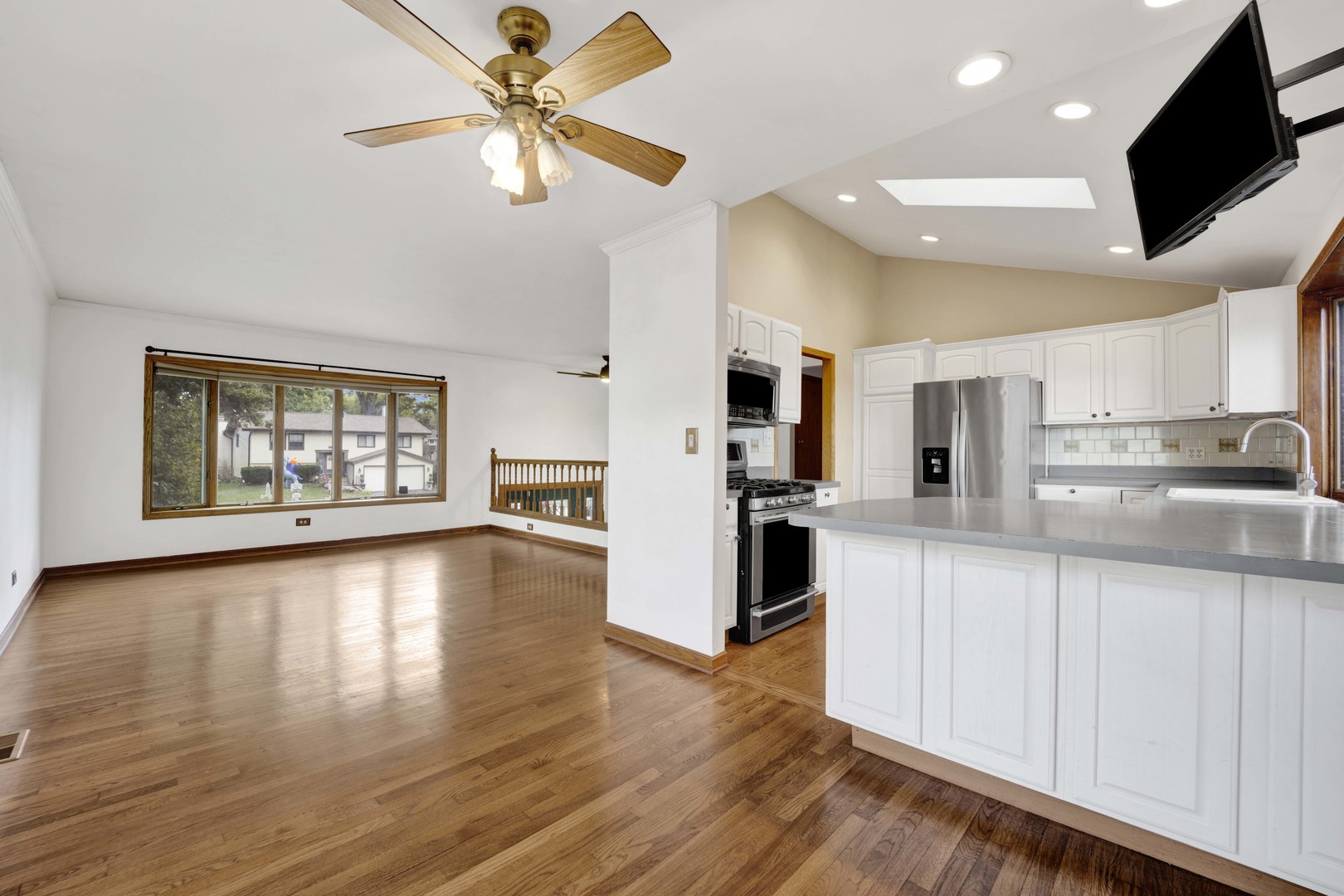2S224 Valley Road Lombard, IL 60148 - Photo 9 of 37 a large kitchen with stainless steel appliances kitchen island a large counter top and a wooden floors