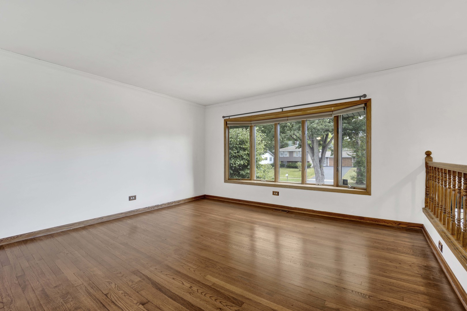 2S224 Valley Road Lombard, IL 60148 - Photo 10 of 37 a view of empty room with wooden floor and fan