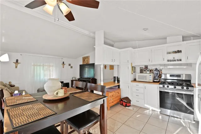 a kitchen with a dining table and chairs