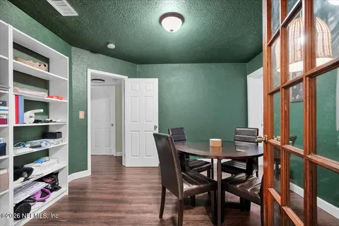a view of a dining room with furniture window and wooden floor