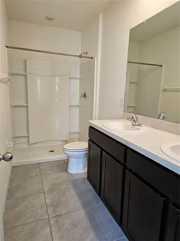 a kitchen with granite countertop a stove and a microwave