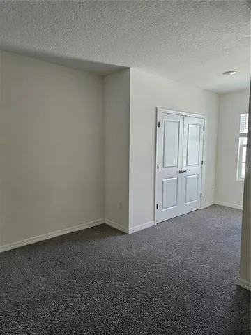 a large kitchen with stainless steel appliances granite countertop a large counter top and a stove