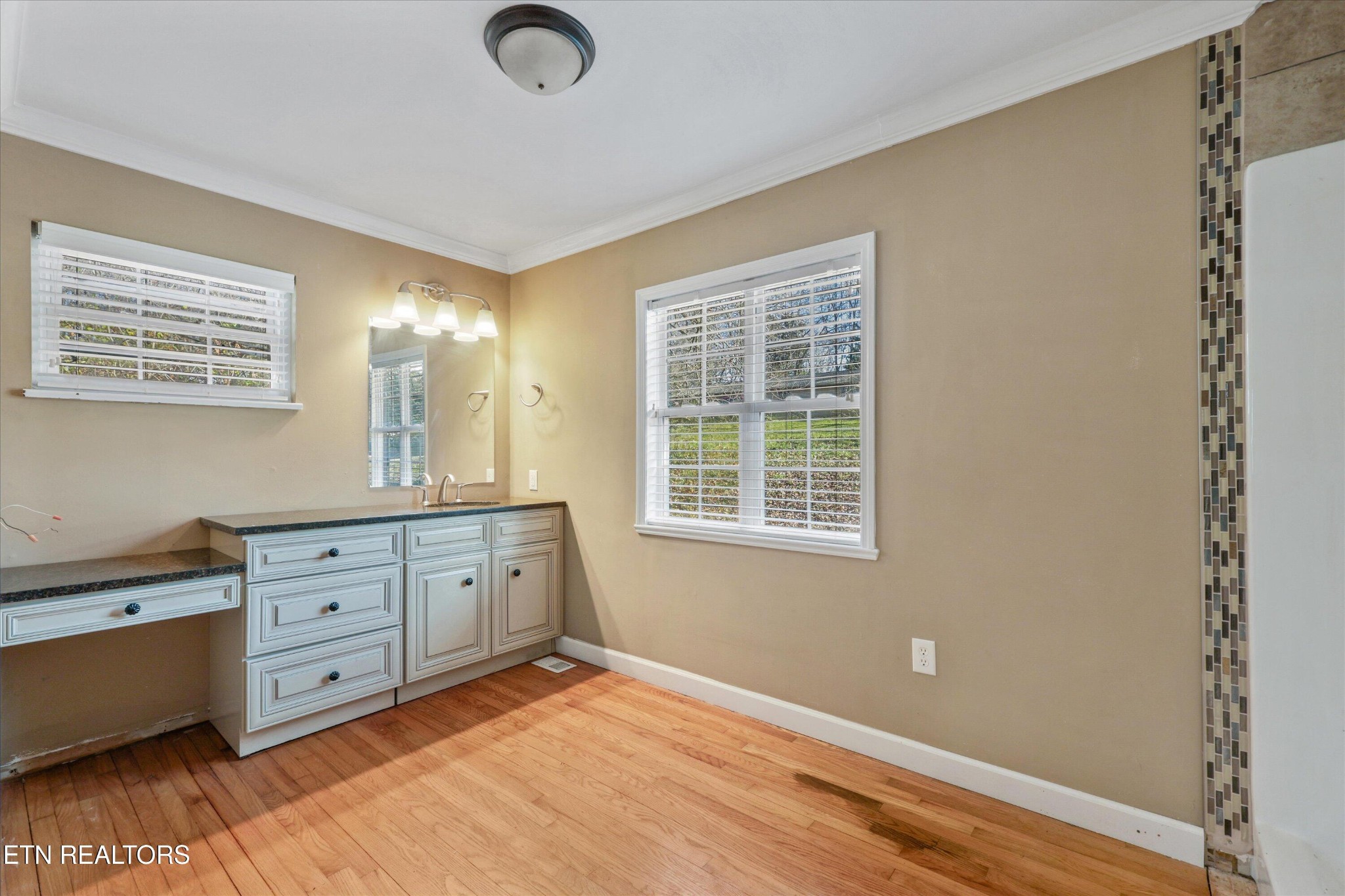 1221 Huntington Road Southwest Knoxville, TN 37919 - Photo 13 of 23 a hall with cabinet a mirror and a window