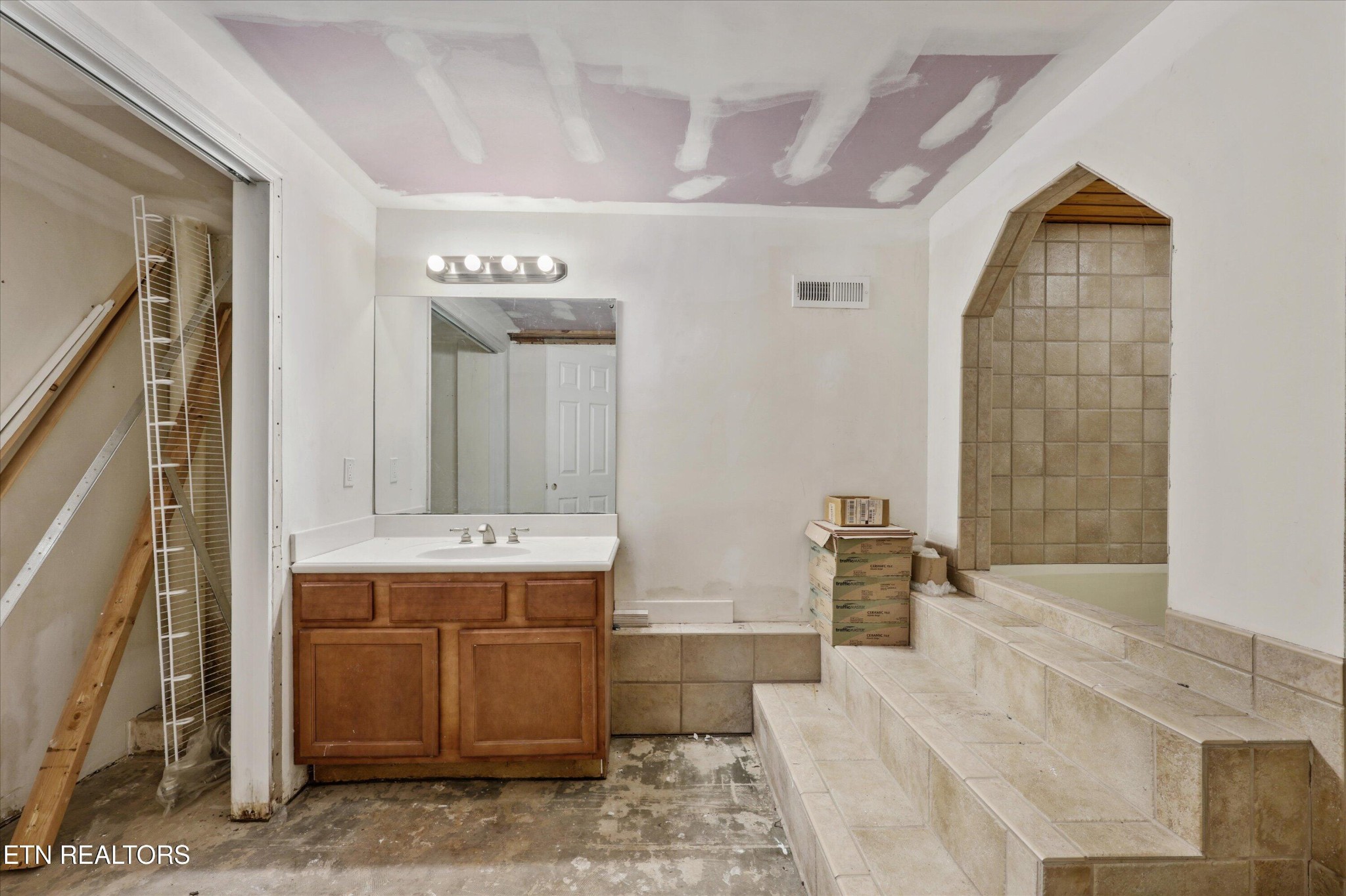 1221 Huntington Road Southwest Knoxville, TN 37919 - Photo 16 of 23 a spacious bathroom with a tub sink and mirror
