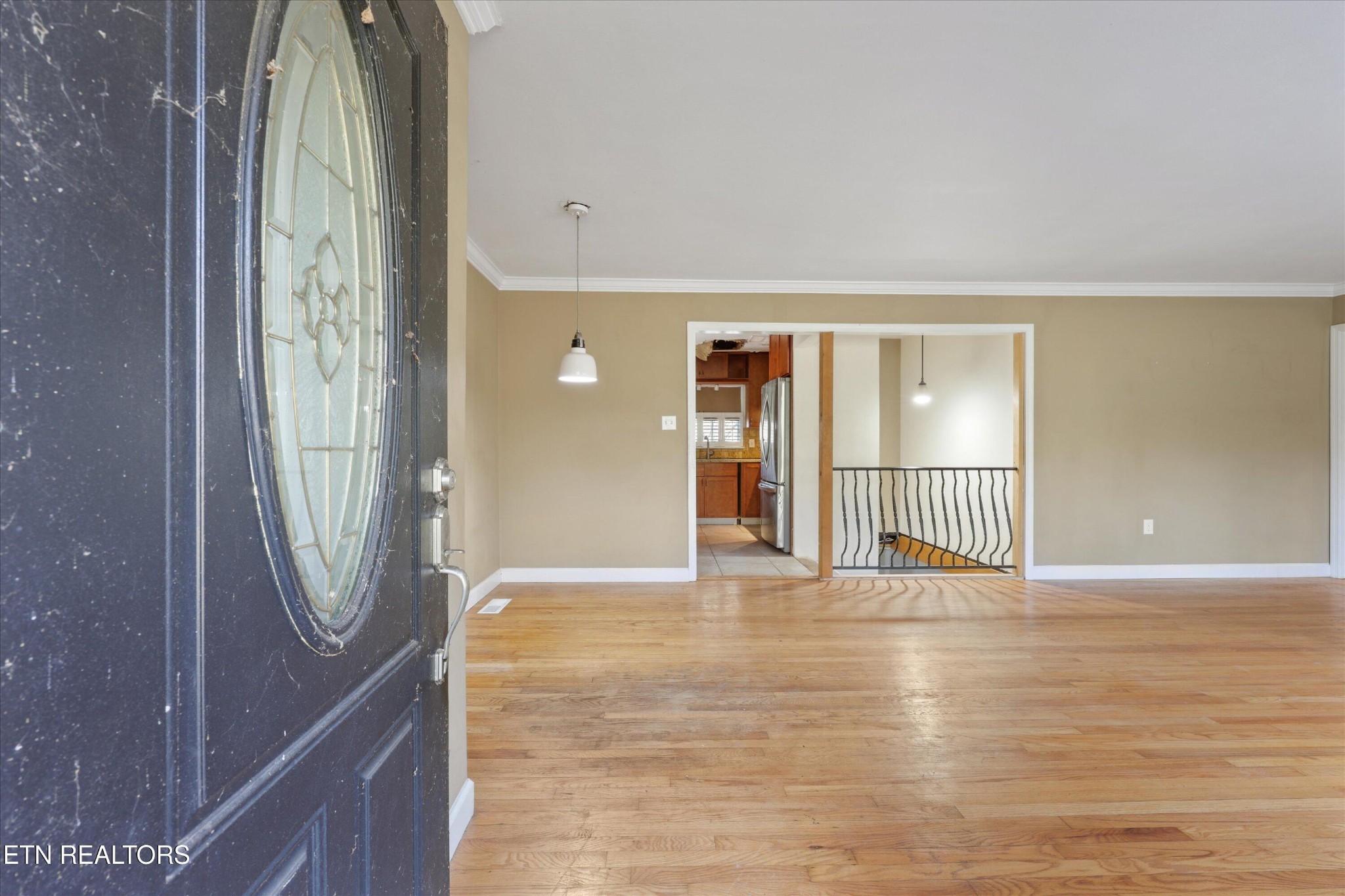 1221 Huntington Road Southwest Knoxville, TN 37919 - Photo 4 of 23 a view of a hallway with wooden floor and stairs