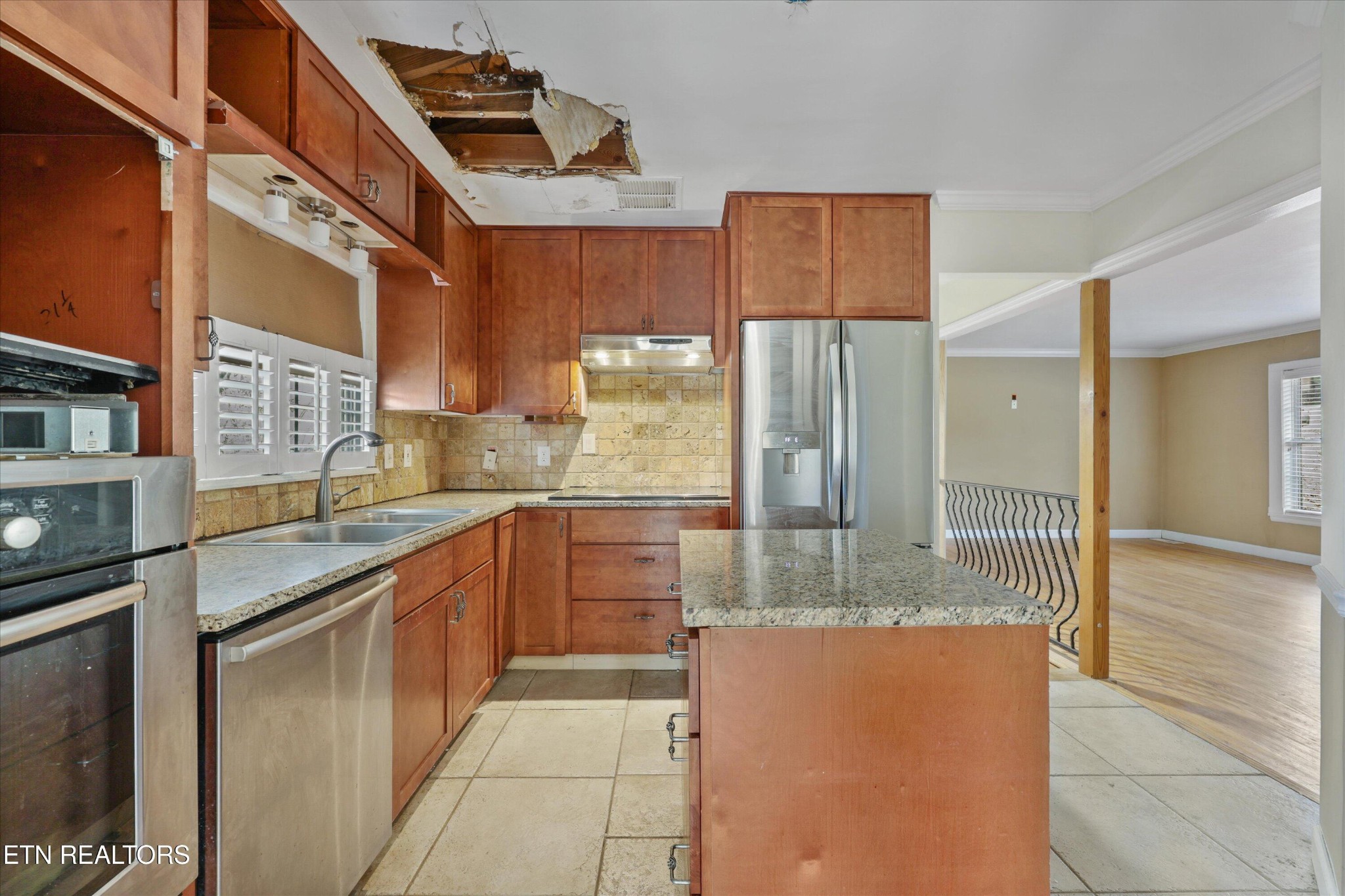 1221 Huntington Road Southwest Knoxville, TN 37919 - Photo 8 of 23 a kitchen with stainless steel appliances granite countertop a refrigerator and a sink