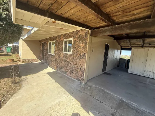 a backyard of a house with seating space