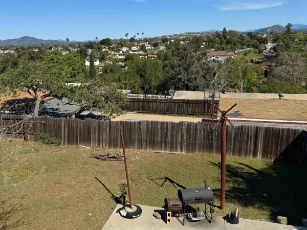 a backyard of a house with lots of green space