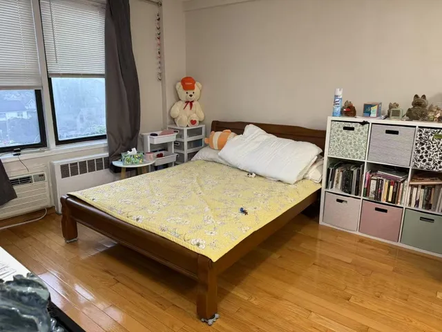 a living room with hard wood floors and a table