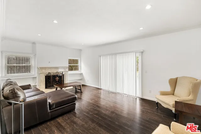 a living room with a couch and a fireplace