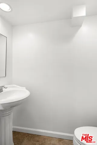 a bathroom with a sink and a toilet