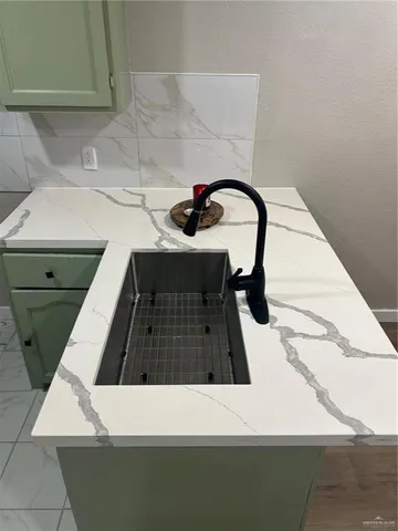 a view of kitchen and sink