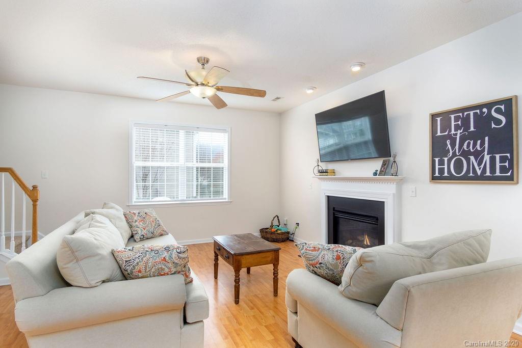 94 Wildbriar Road Fletcher, NC 28732 - Photo 2 of 27 a living room with furniture a fireplace and a flat screen tv