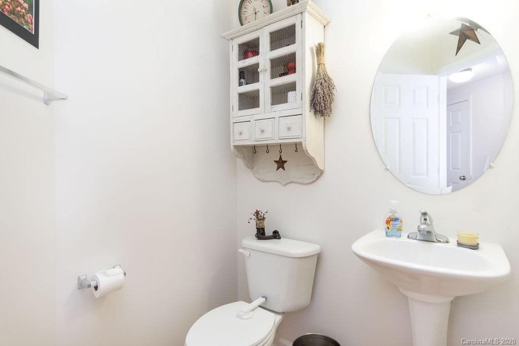 94 Wildbriar Road Fletcher, NC 28732 - Photo 11 of 27 a bathroom with a sink mirror and toilet