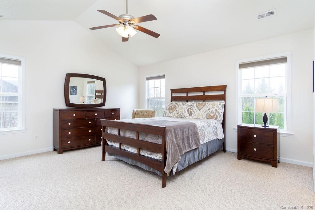 94 Wildbriar Road Fletcher, NC 28732 - Photo 12 of 27 a bedroom with a bed and window