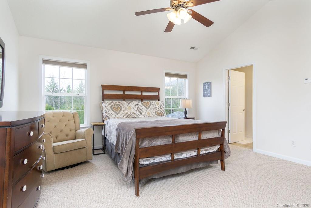94 Wildbriar Road Fletcher, NC 28732 - Photo 13 of 27 a bedroom with a bed couch and window