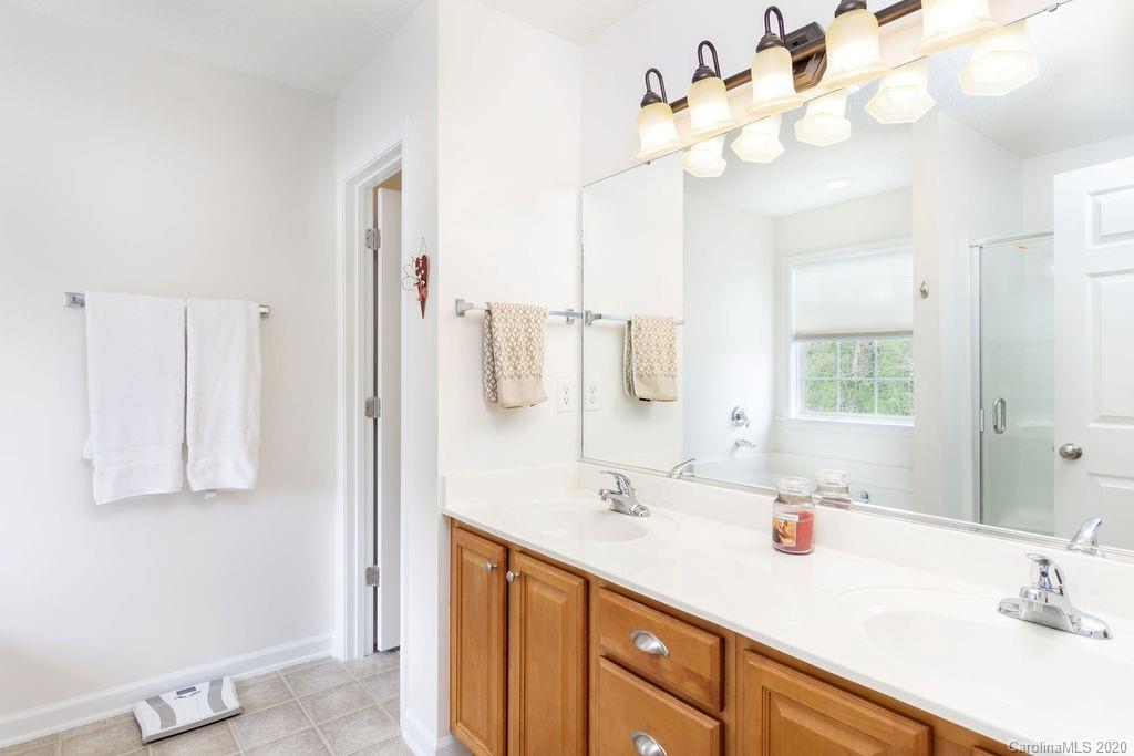94 Wildbriar Road Fletcher, NC 28732 - Photo 14 of 27 a bathroom with a sink vanity and mirror