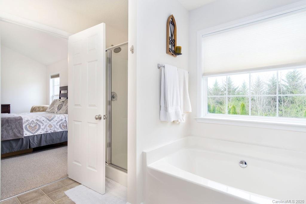 94 Wildbriar Road Fletcher, NC 28732 - Photo 15 of 27 a bathroom with a bathtub and a shower