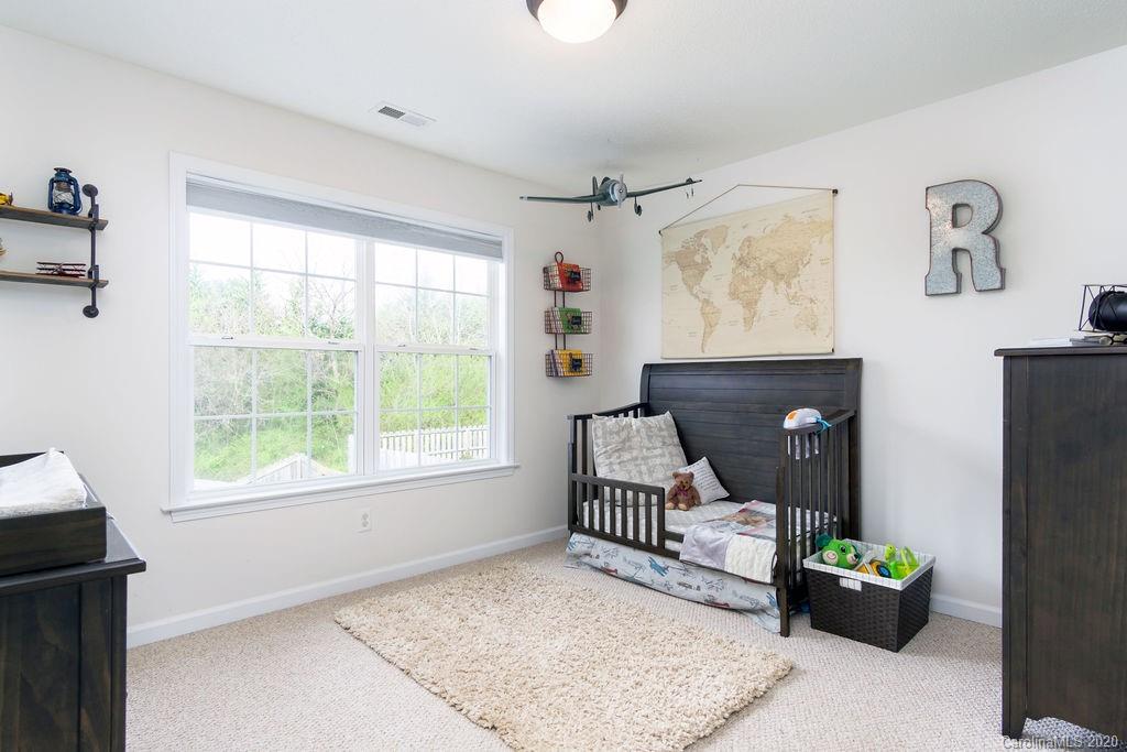 94 Wildbriar Road Fletcher, NC 28732 - Photo 16 of 27 a bedroom with furniture and a window