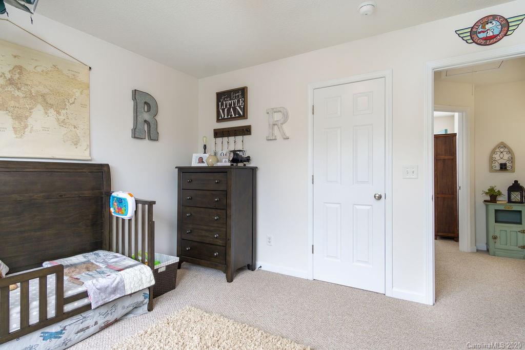 94 Wildbriar Road Fletcher, NC 28732 - Photo 17 of 27 a bedroom with furniture and dresser