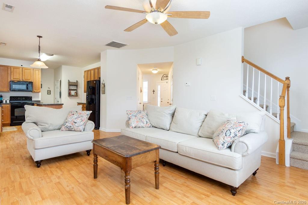94 Wildbriar Road Fletcher, NC 28732 - Photo 3 of 27 a living room with furniture and a chandelier