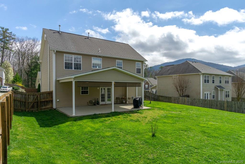 94 Wildbriar Road Fletcher, NC 28732 - Photo 21 of 27 a view of a house with a yard and sitting area