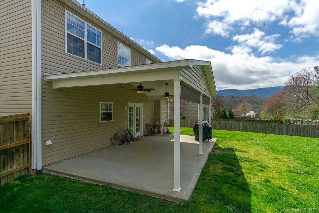 94 Wildbriar Road Fletcher, NC 28732 - Photo 22 of 27 a view of an house with backyard porch and garden