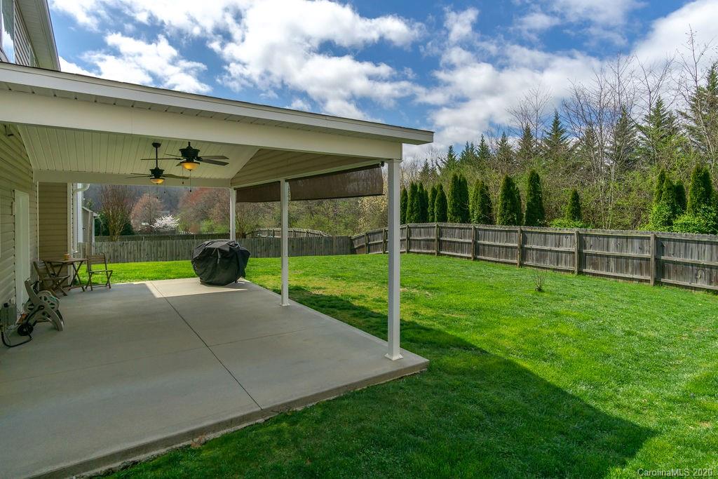 94 Wildbriar Road Fletcher, NC 28732 - Photo 23 of 27 a view of a backyard with plants and a garden