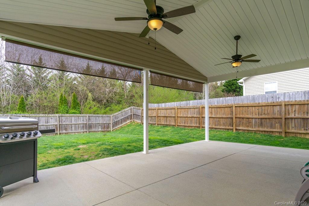 94 Wildbriar Road Fletcher, NC 28732 - Photo 24 of 27 a view of a backyard with wooden fence
