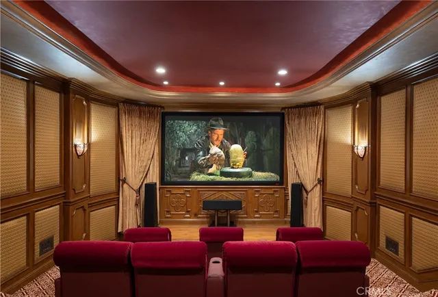 a media room with lots of chairs and a projector
