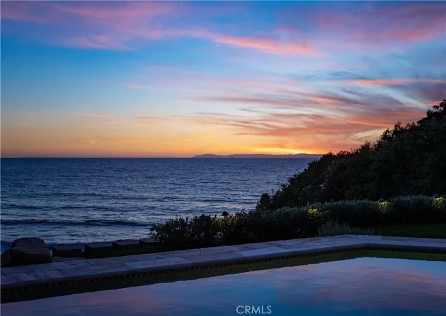 a view of a yard with an ocean
