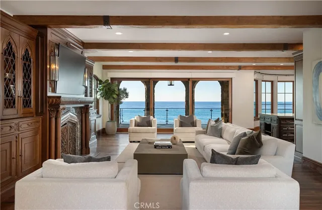 a living room with fireplace furniture and a fireplace