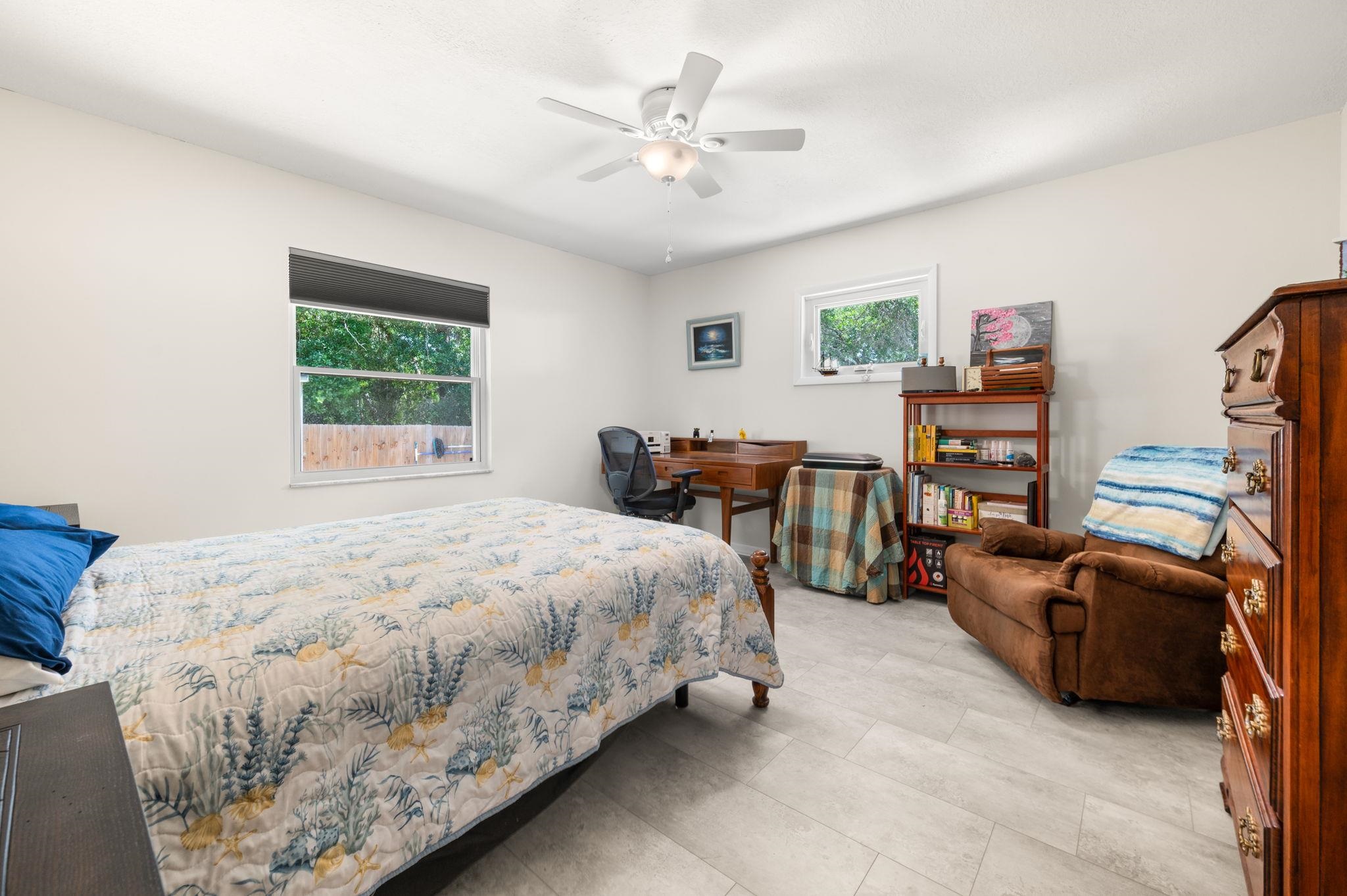 507 Gentian Road St. Augustine, FL 32086 - Photo 24 of 82 a spacious bedroom with a bed and a couch