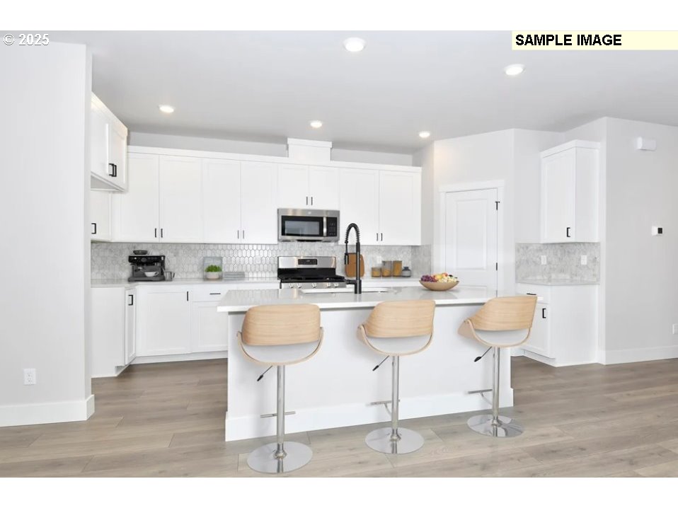 16782 Southwest Perth Road Tigard, OR 97224 - Photo 6 of 13 a kitchen with counter space and appliances