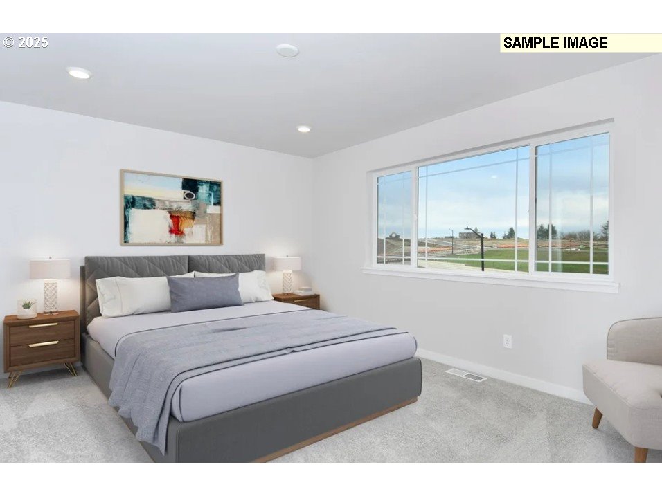 16782 Southwest Perth Road Tigard, OR 97224 - Photo 9 of 13 a bedroom with a bed and a large window