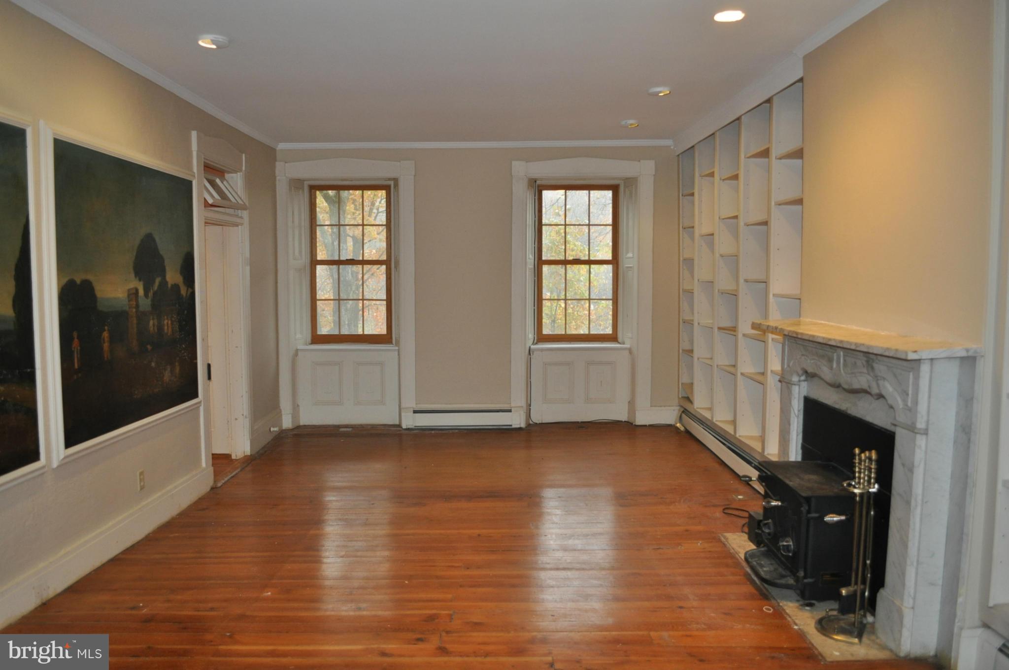 205 Hoff Road Union Bridge, MD 21791 - Photo 12 of 30 a view of an empty room with a fireplace and a window