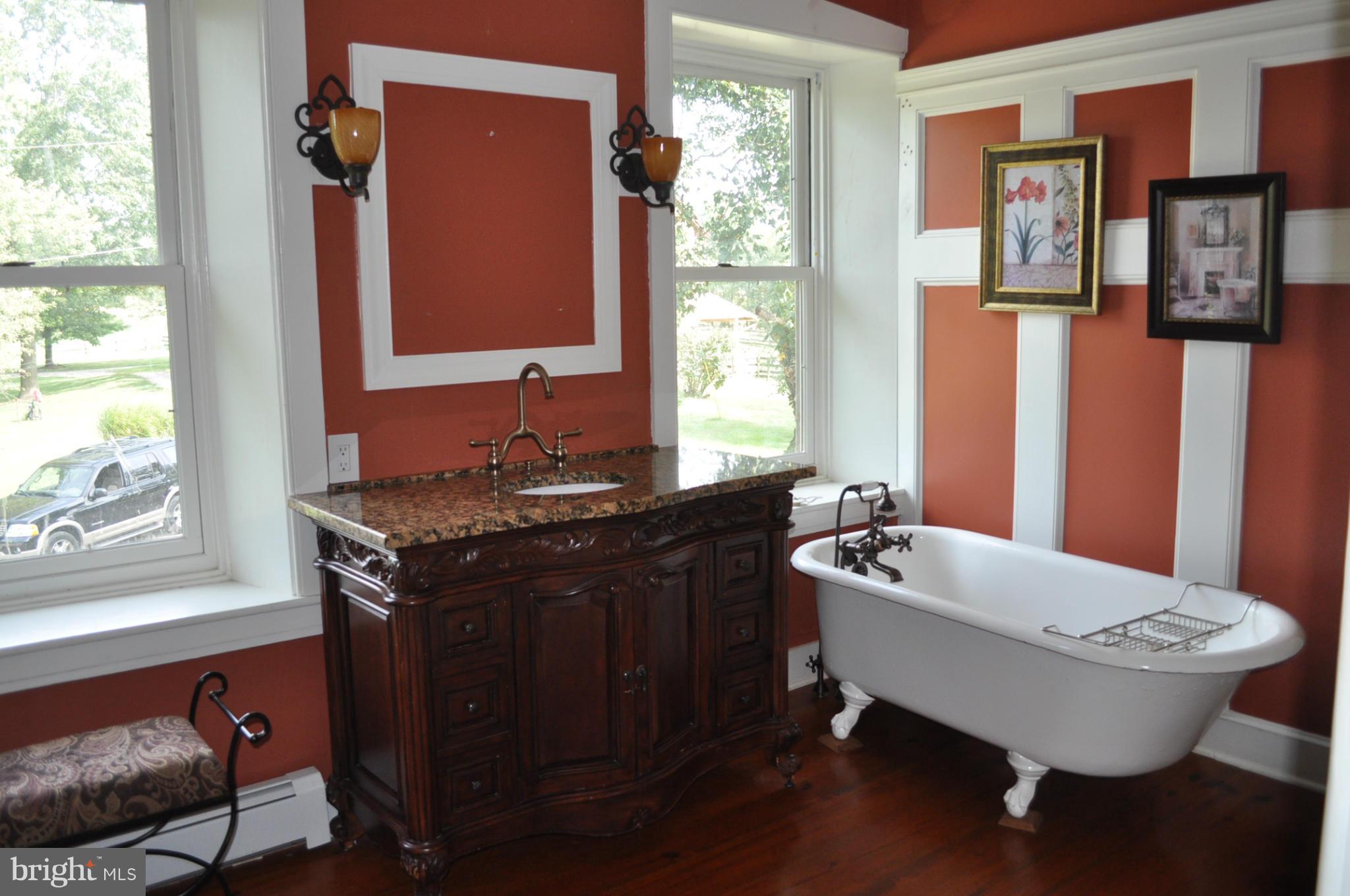 205 Hoff Road Union Bridge, MD 21791 - Photo 13 of 30 a bathroom with a granite countertop sink and a mirror