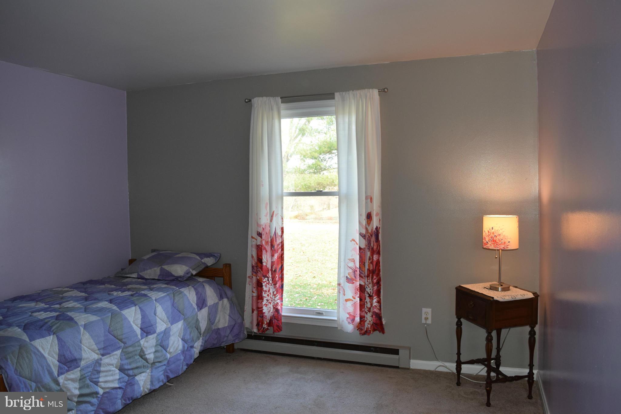 205 Hoff Road Union Bridge, MD 21791 - Photo 23 of 30 a bed sitting in a bedroom next to a window