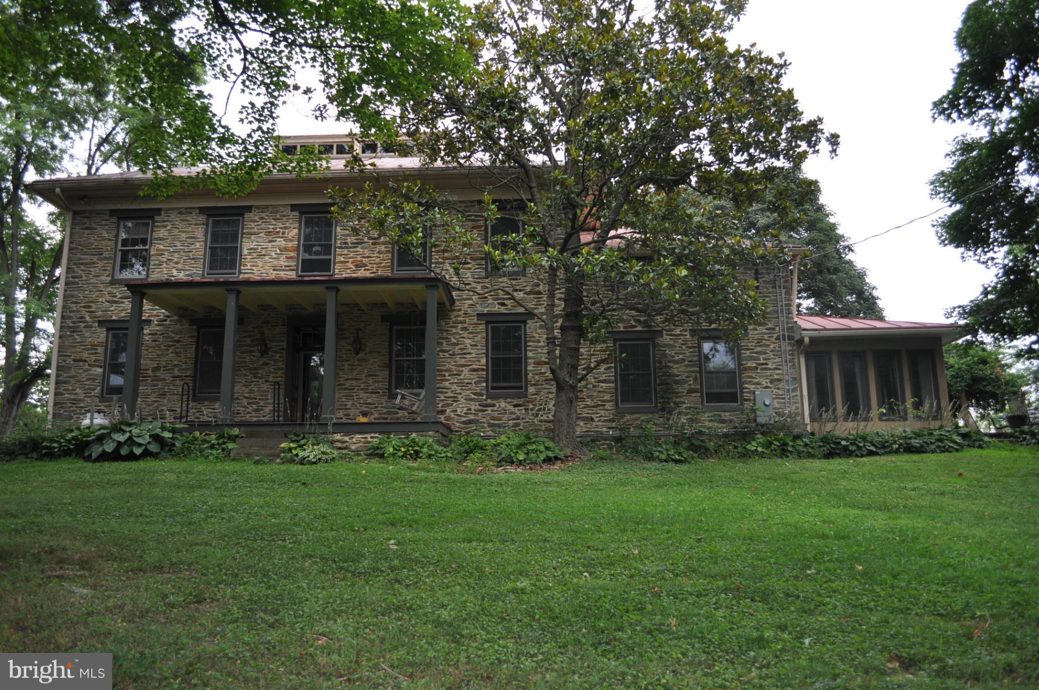 205 Hoff Road Union Bridge, MD 21791 - Photo 4 of 30 a front view of a house with a garden