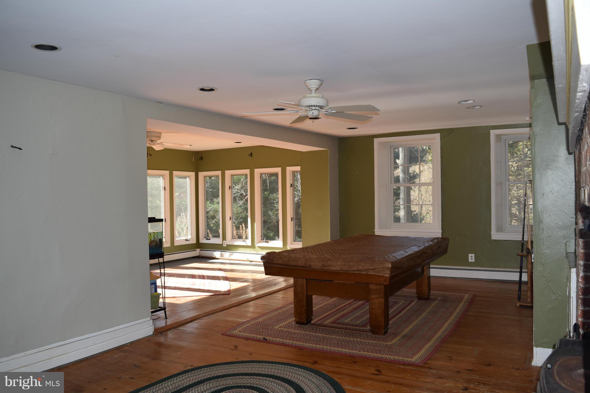 205 Hoff Road Union Bridge, MD 21791 - Photo 9 of 30 a living room with a table chairs and a chandelier