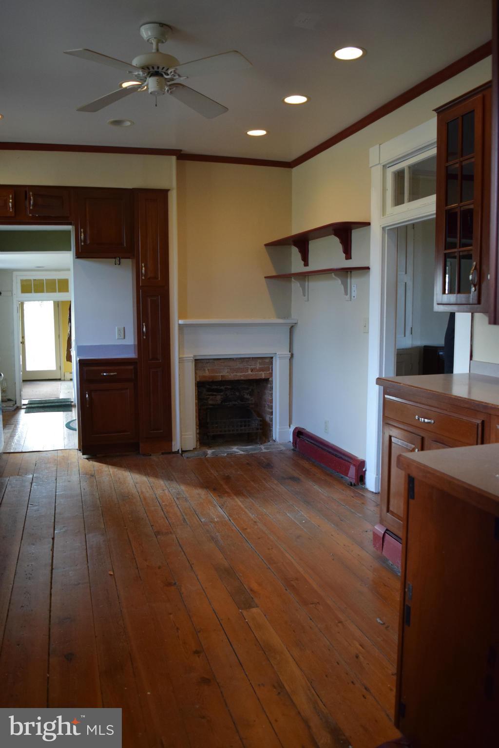 205 Hoff Road Union Bridge, MD 21791 - Photo 10 of 30 a view of empty room with kitchen and fireplace