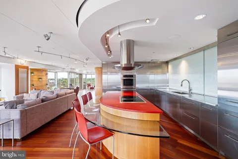 a bathroom with a shower and a glass door