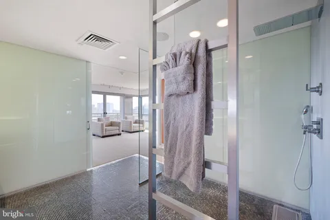 a white toilet sitting next to a bathroom sink