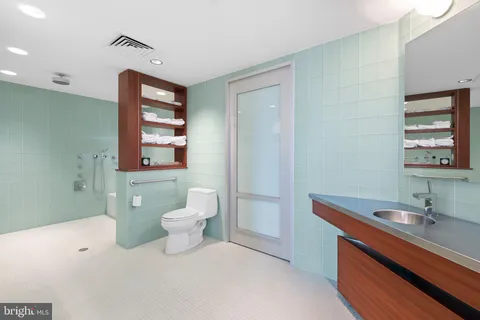 a view of work space with furniture and a flat screen tv