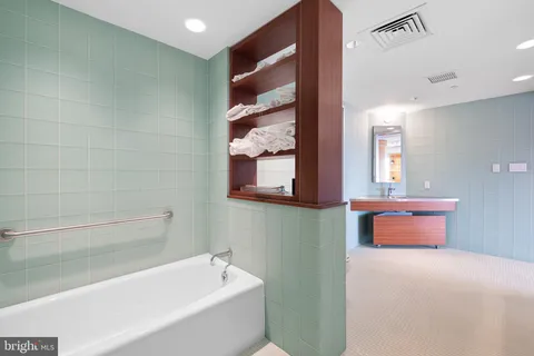 a living room with hard wood flooring and furniture