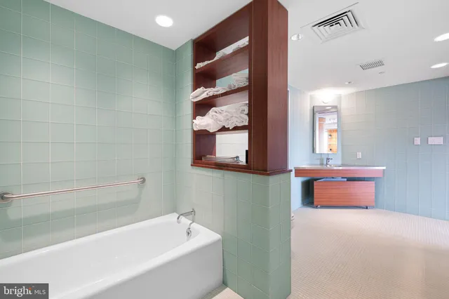 a living room with hard wood flooring and furniture