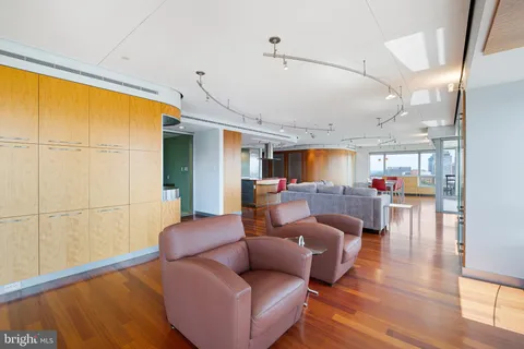 a kitchen with stainless steel appliances granite countertop a sink and a refrigerator