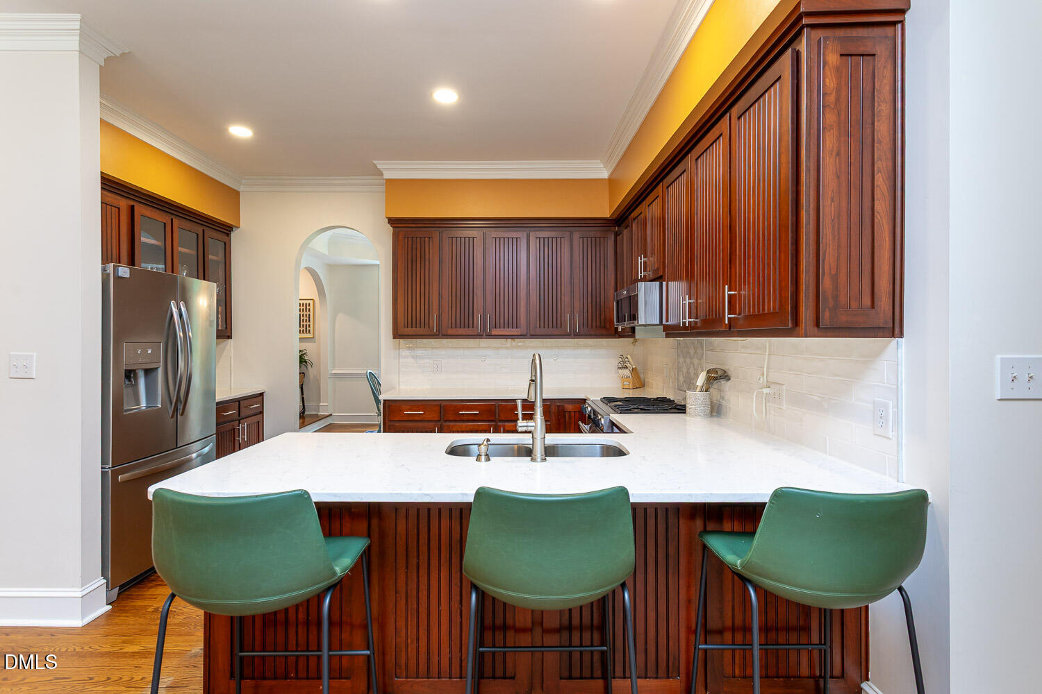 8509 Towneley Place Raleigh, NC 27615 - Photo 13 of 36 a kitchen with stainless steel appliances granite countertop a table chairs and a refrigerator